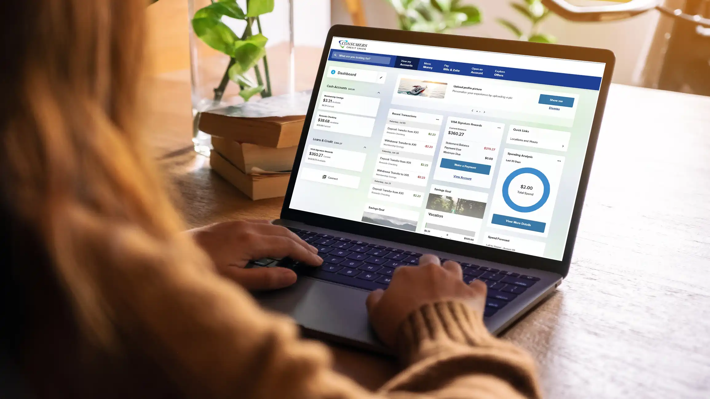 Woman on laptop using new CCU digital banking platform