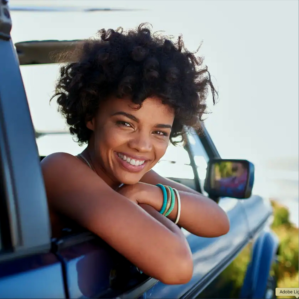 Happy woman in car